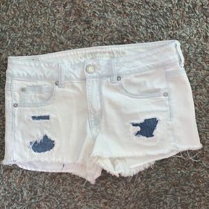 EUC AMERICAN EAGLE SIZE 8 DISTRESSED ANS PATCHED SHORTIE SHORTS